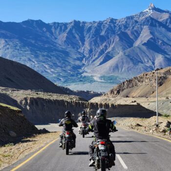 Biker crossing Tanglang La on the Manali to Leh Bike Tour