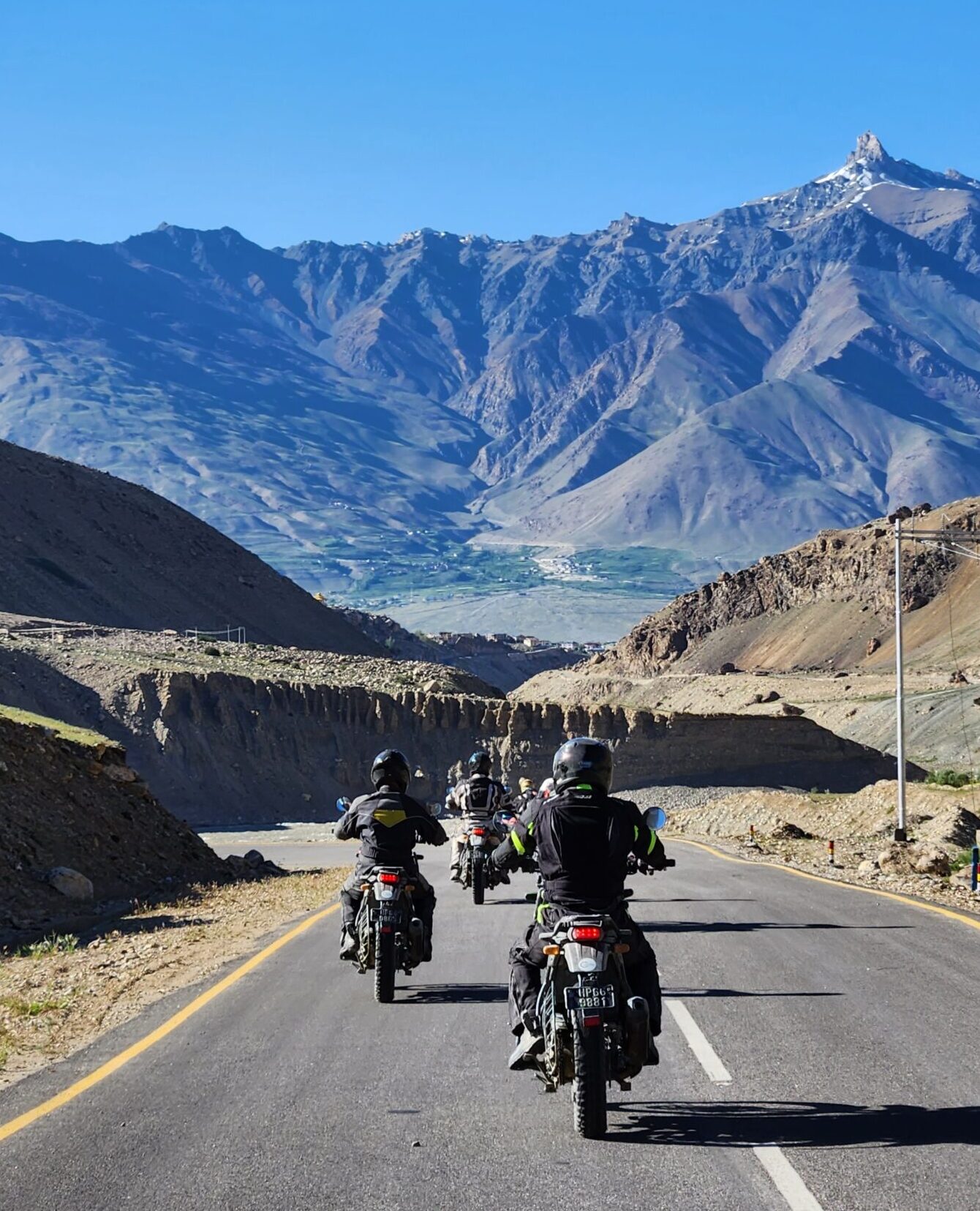 Biker crossing Tanglang La on the Manali to Leh Bike Tour