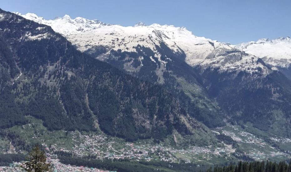 Trekkers walking through pine forest on the Lamadugh Trek trail in Old Manali
