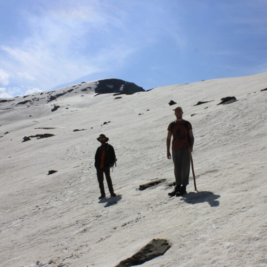 Trekkers on Chanderkhani Pass Trek through alpine meadows